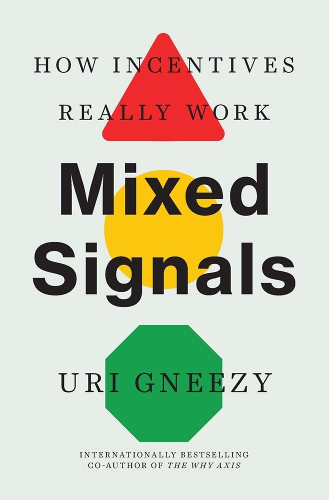 Hardback copy of "Mixed Signals" by Uri Gneezy, showcasing the book cover and spine design.