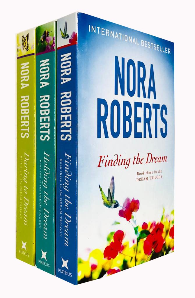Set of three Nora Roberts Dream Trilogy paperback books by Piatkus, featuring colorful covers and fictional story titles.