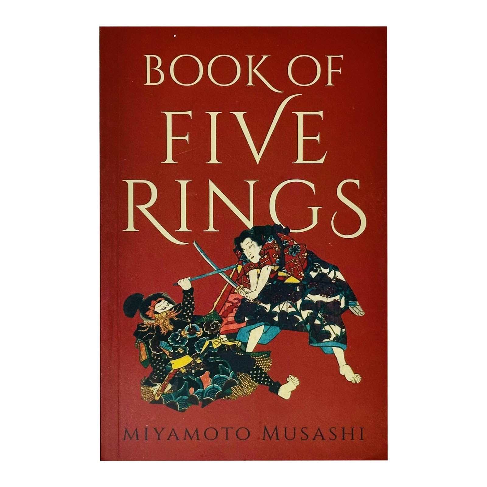 Paperback edition of "Book of Five Rings" by Miyamoto Musashi, showcasing the cover design and title prominently.