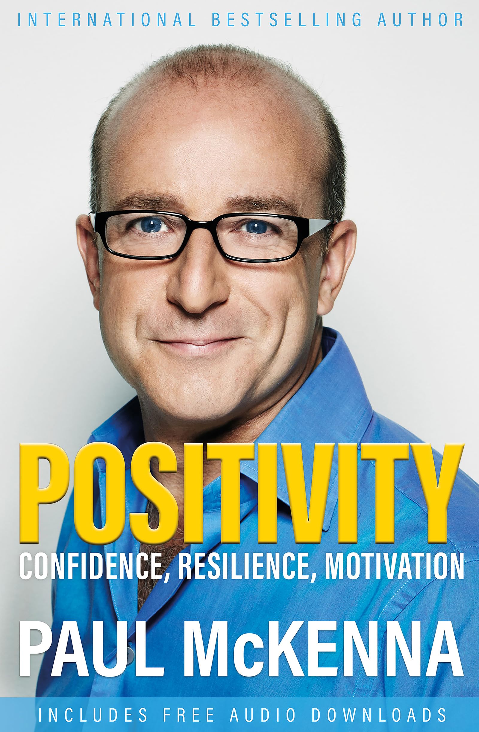 Paperback book "Positivity: Confidence, Resilience, Motivation" by Paul McKenna on a plain background.