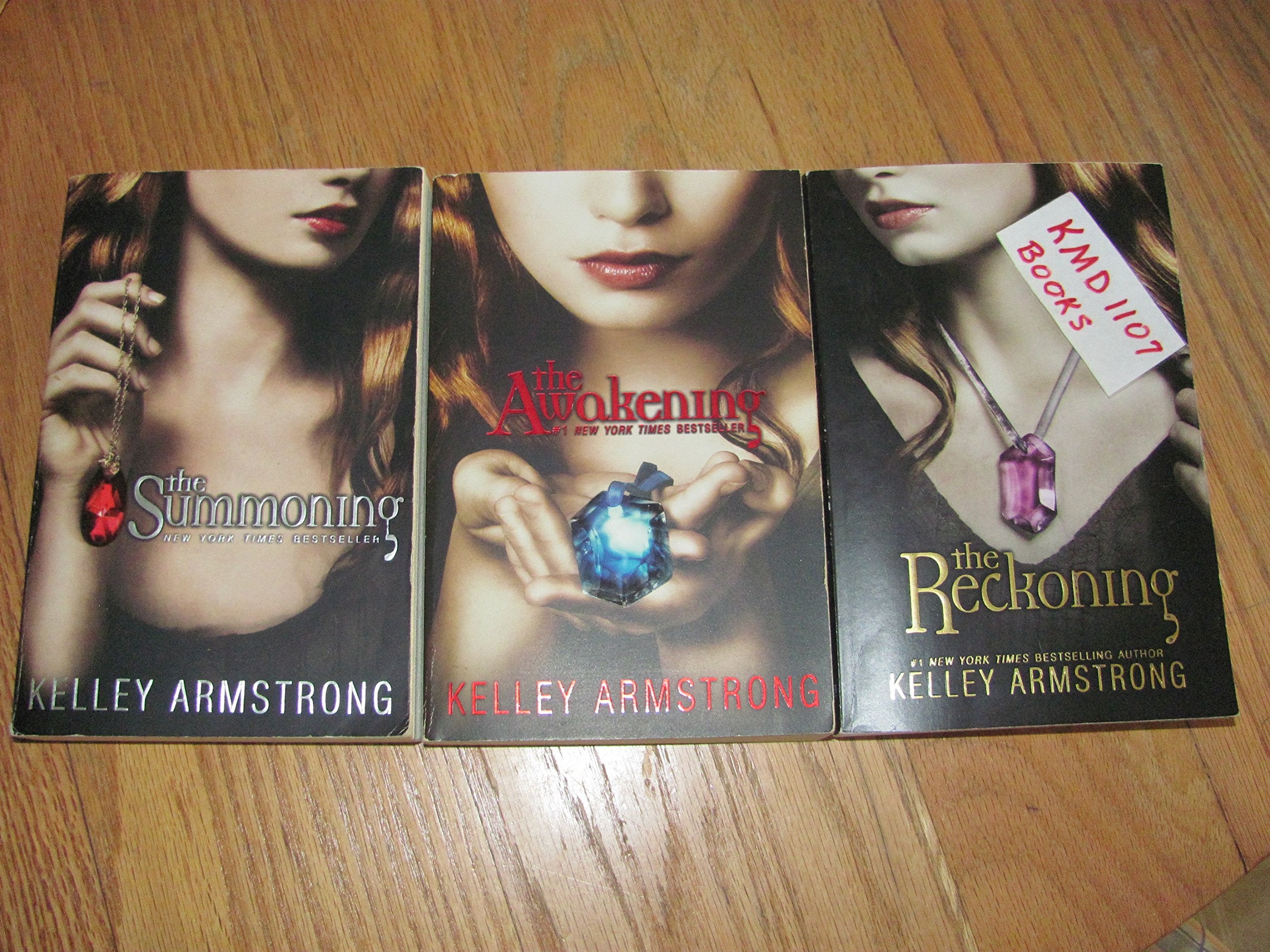 Three paperback books from the Reckoning Saga by various authors, showcasing fiction themes and colorful covers.