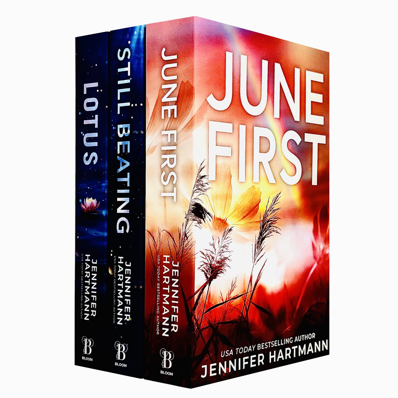 Front cover view of the Jennifer Hartmann 3-book paperback set featuring Still Beating, Lotus, and June First side by side.