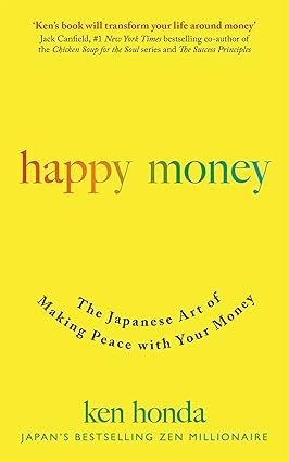 Money Mindset Collection by Lewis Howes, three paperback non-fiction books stacked on a wooden surface.