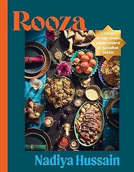 Rooza Collection paperback set by Nadiya Hussain featuring two non-fiction books on a wooden table with soft lighting.