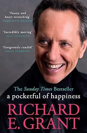 Two paperback books of celebrity memoirs by various authors, featuring Richard E. Grant's work, displayed on a wooden surface.