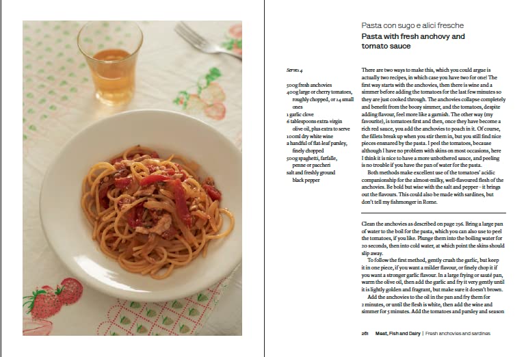 Hardback copy of "Two Kitchens" by Rachel Roddy showcasing the book cover with vibrant food imagery.