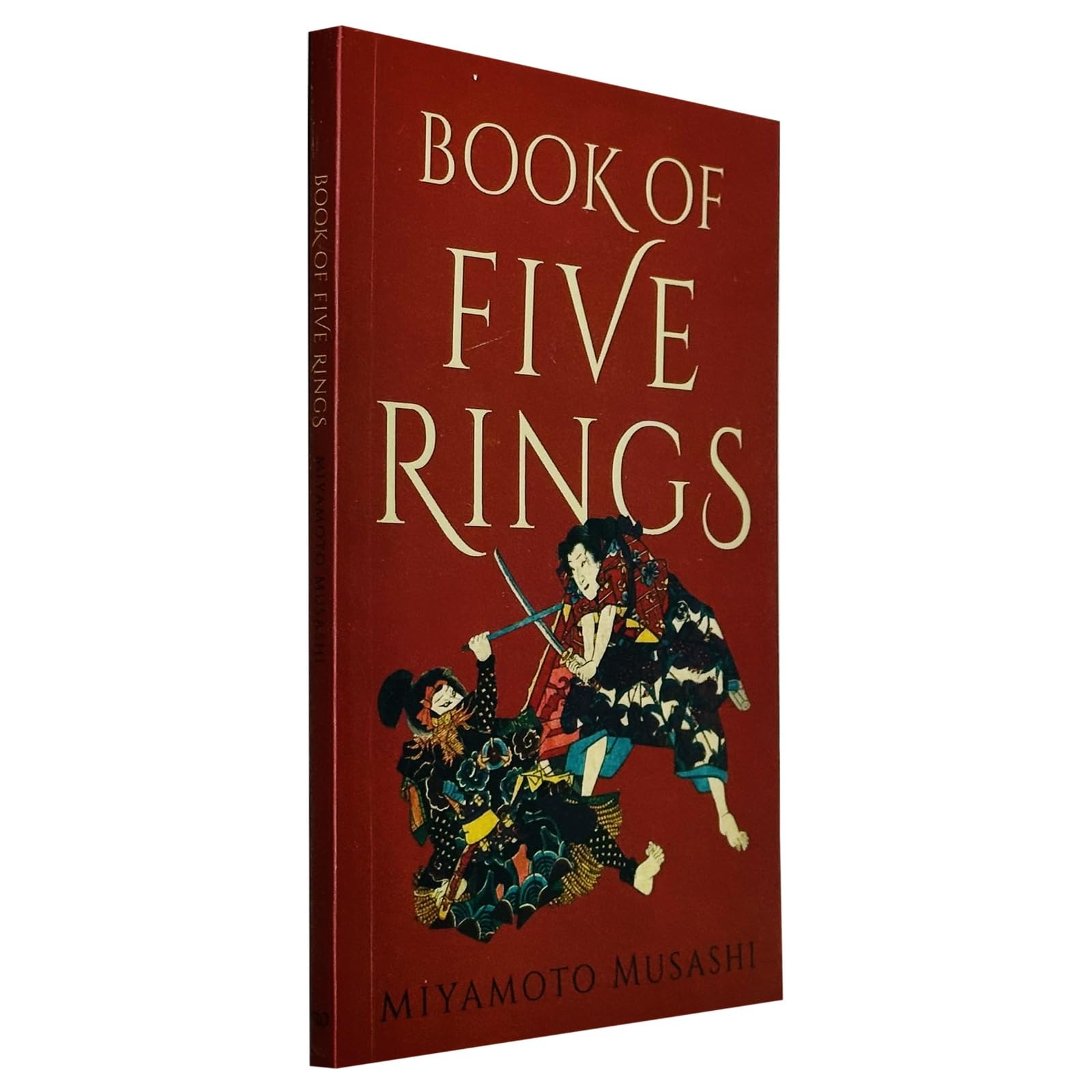 Paperback edition of "Book of Five Rings" by Miyamoto Musashi, featuring a simple cover design and clear text.