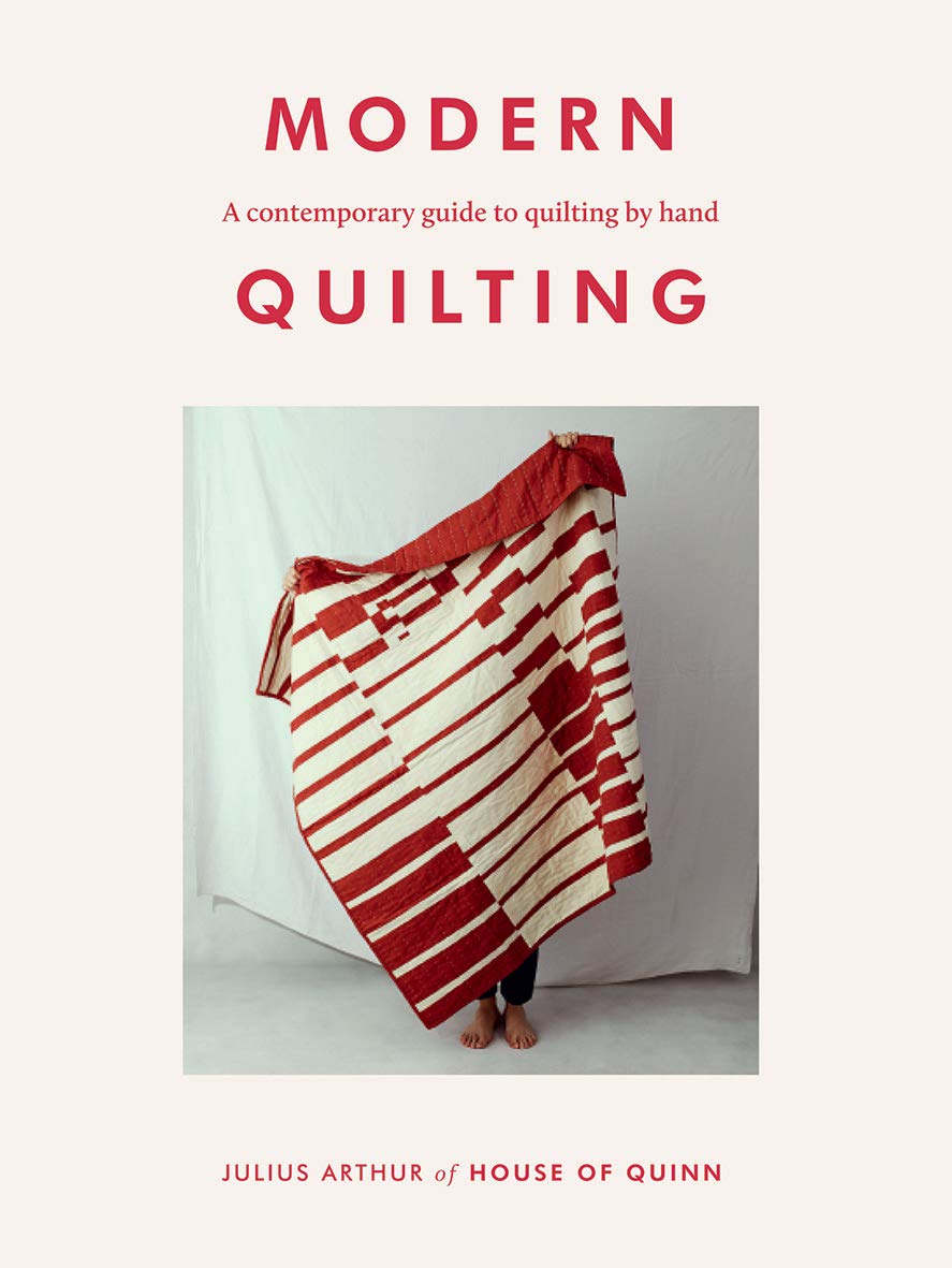 Modern Quilting guide by Julius Arthur, showing a paperback cover with quilting patterns and techniques.
