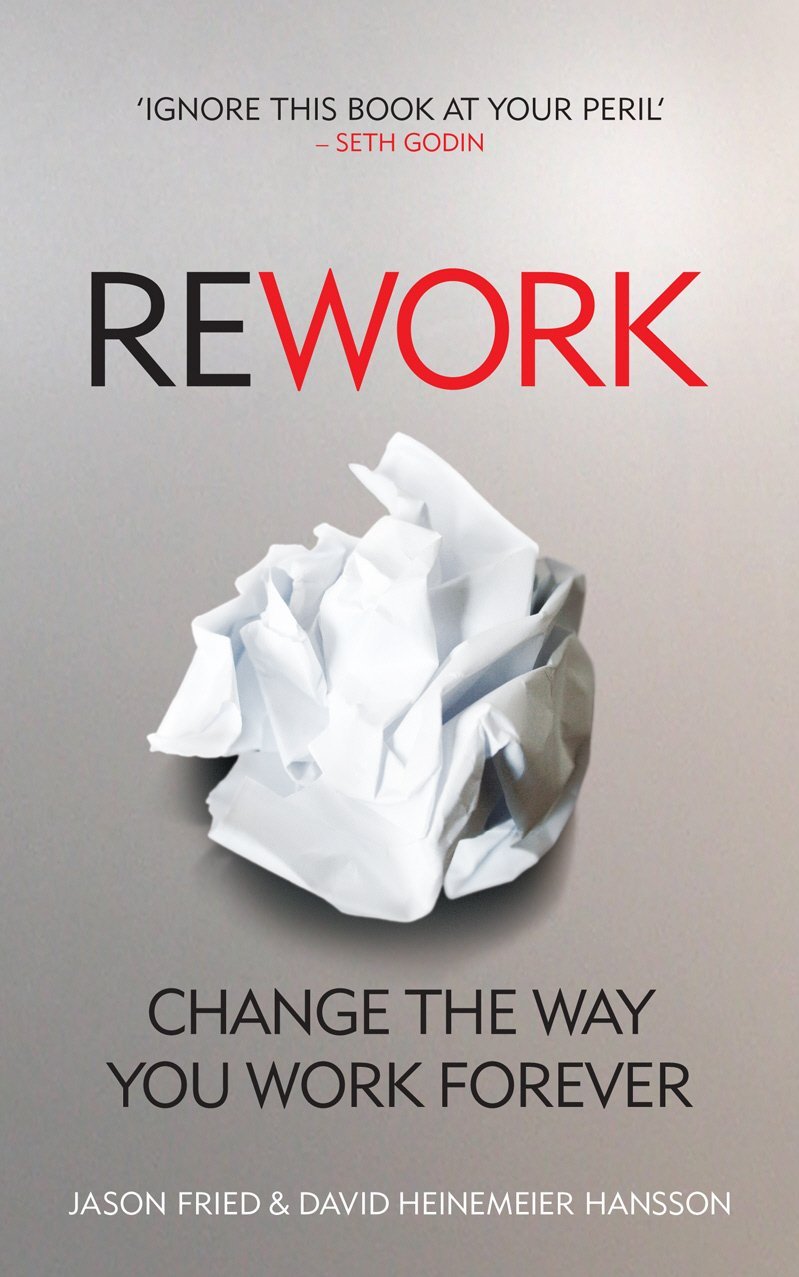 Two paperback books, "Rework" and "Crazy at Work," by Jason Fried, displayed together with covers visible.