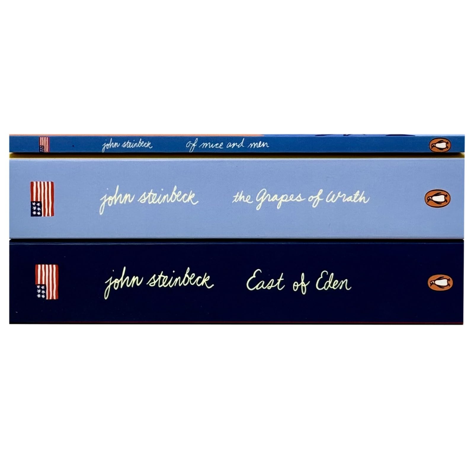 Set of three paperback John Steinbeck books from the Mr John Steinbeck Collection by Penguin, featuring classic fiction covers.