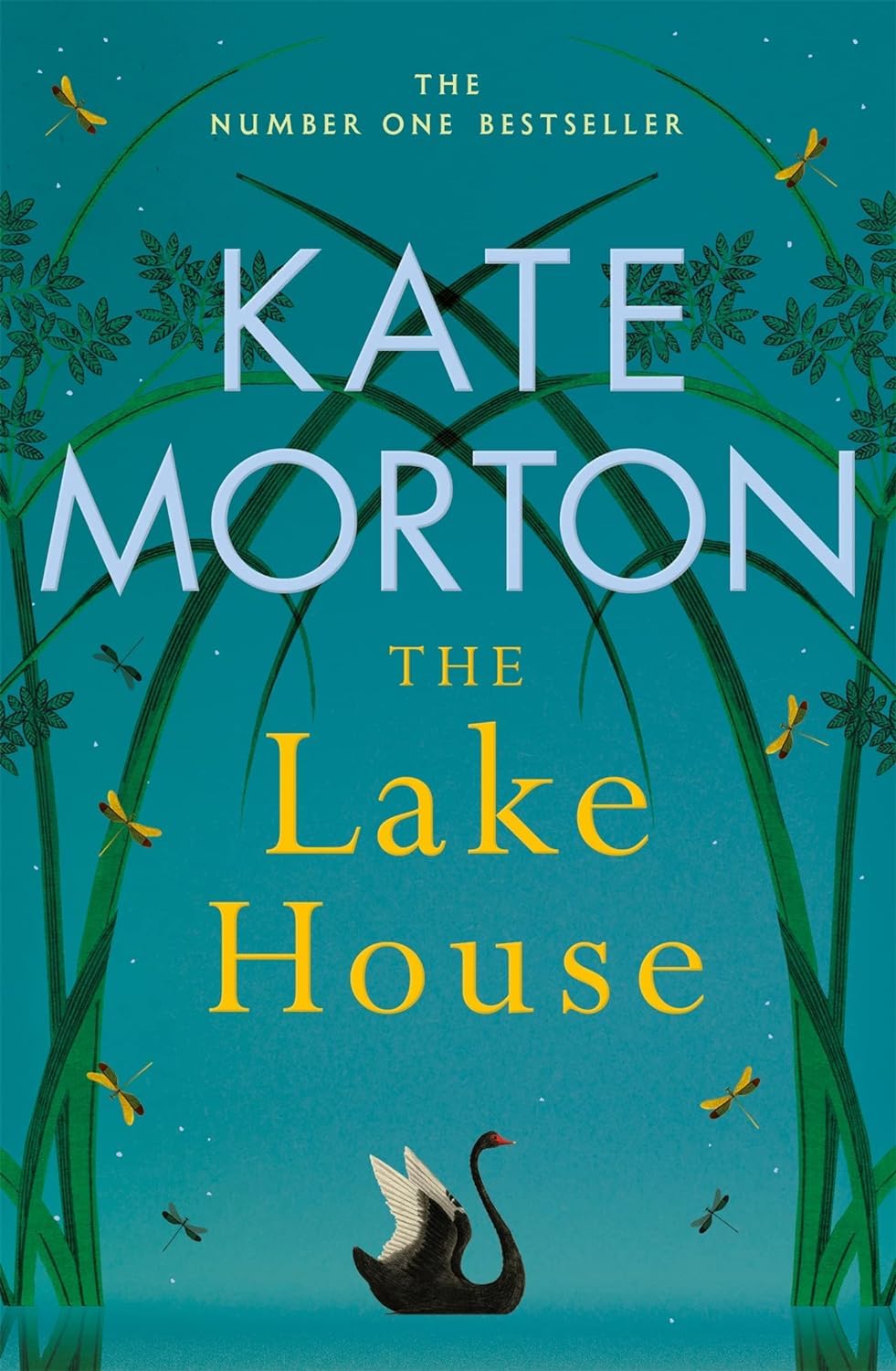 Kate Morton paperback book collection featuring five fiction titles stacked together on a wooden surface.