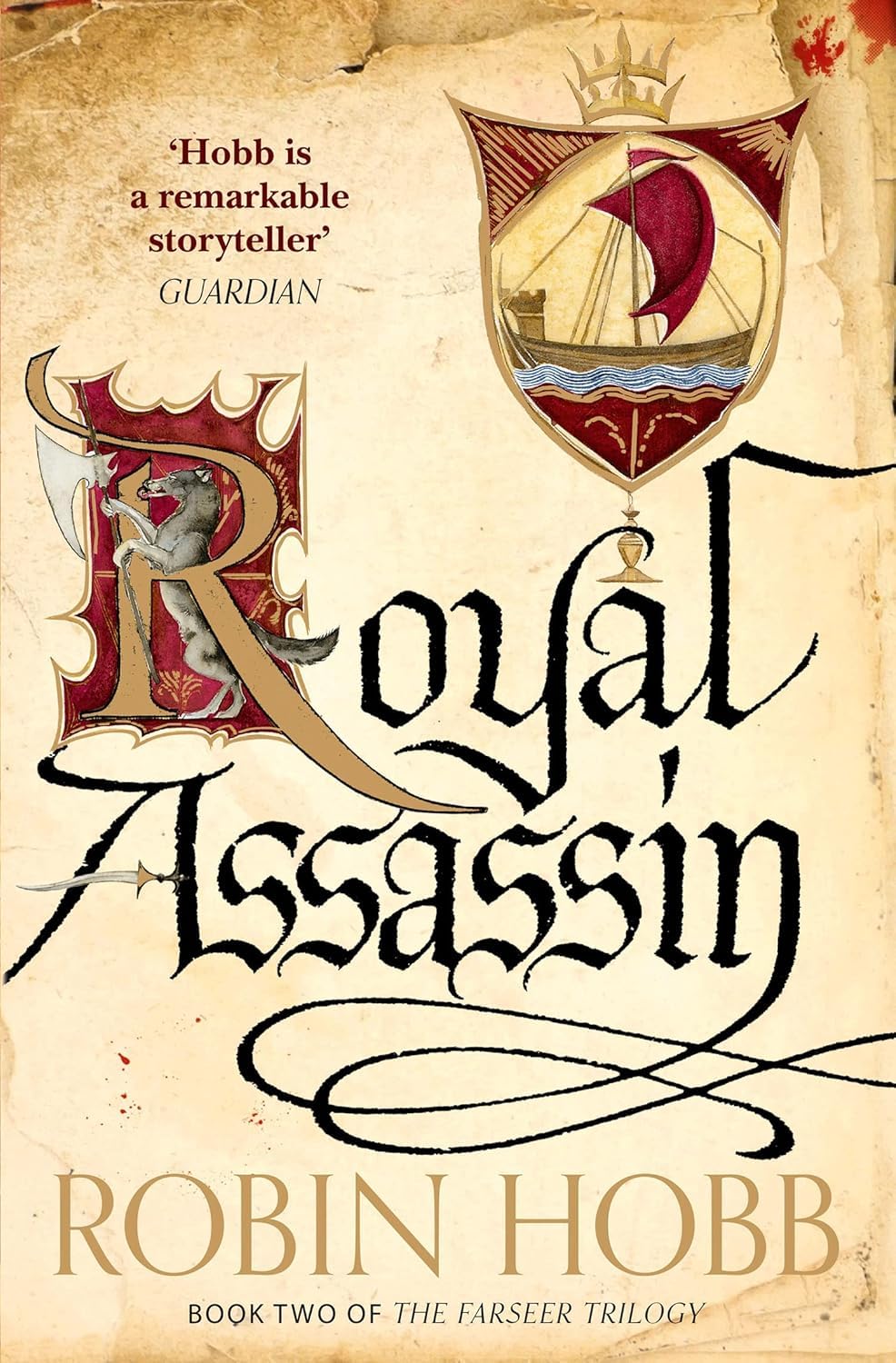 Three paperback books from Robin Hobb's Farseer Trilogy collection, featuring fantasy fiction with illustrated covers.