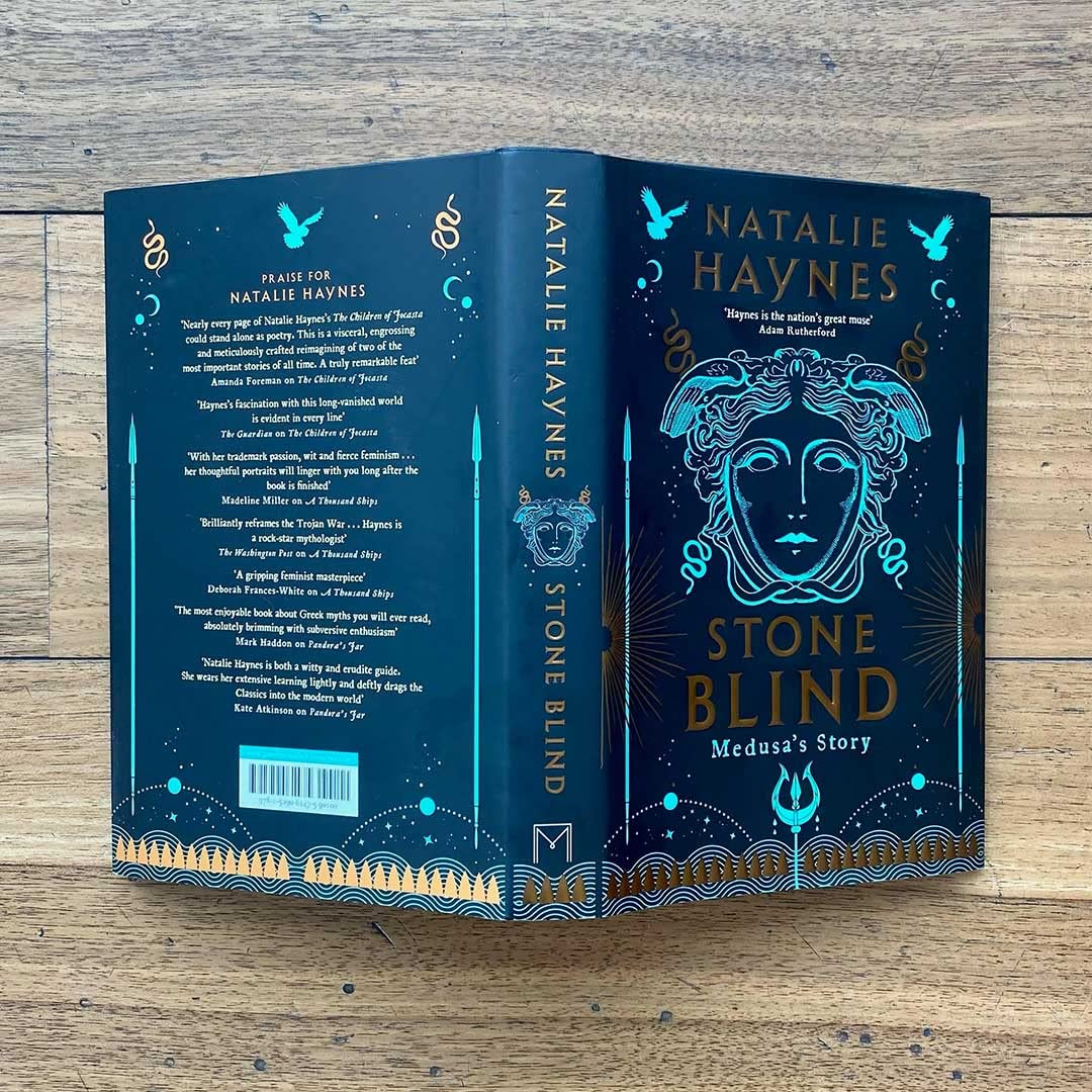 Hardback edition of "Stone Blind" by Natalie Haynes displayed on a mantle, showcasing its cover design and spine.