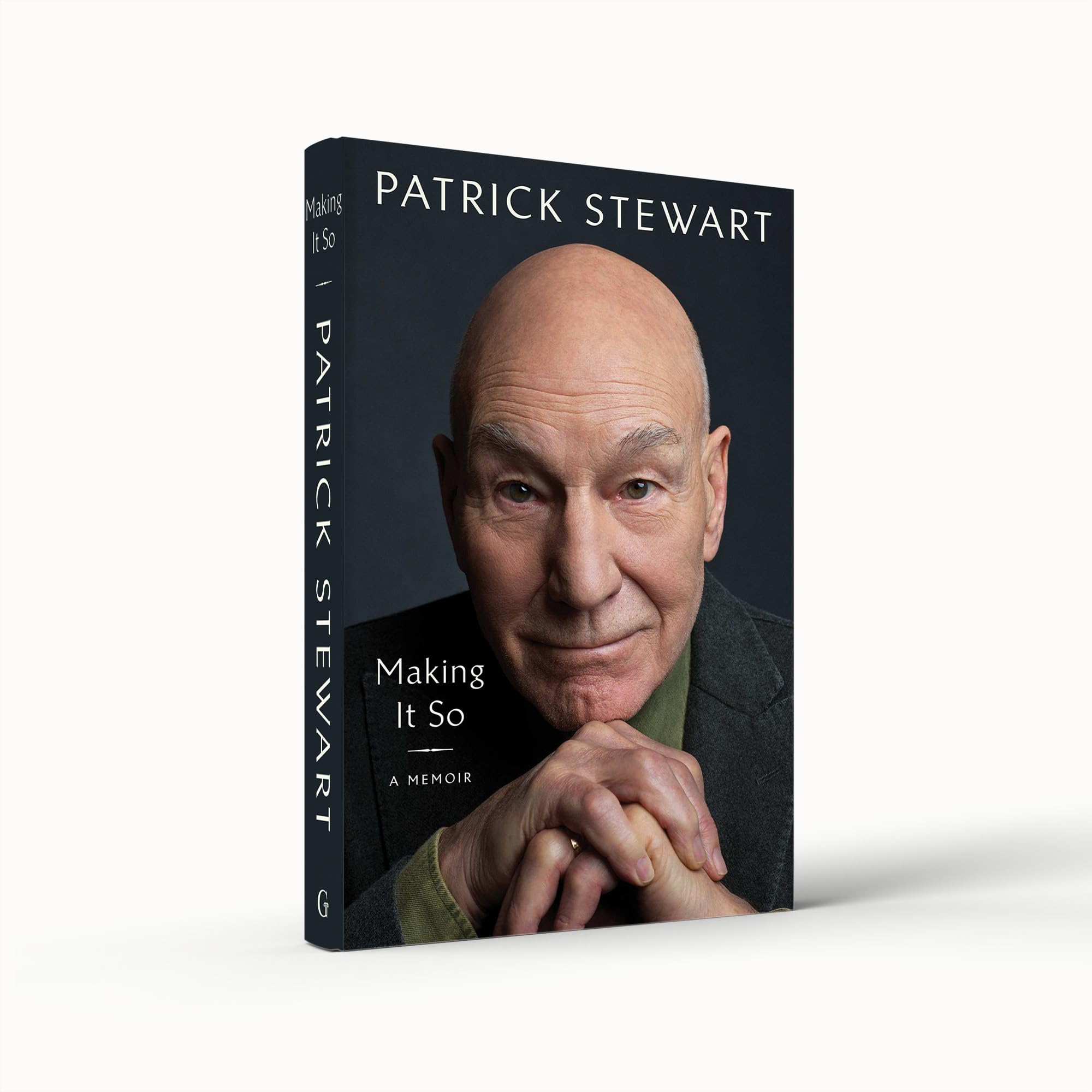 Hardback copy of "Making It So" memoir by Patrick Stewart, featuring a colorful cover and author's name prominently displayed.