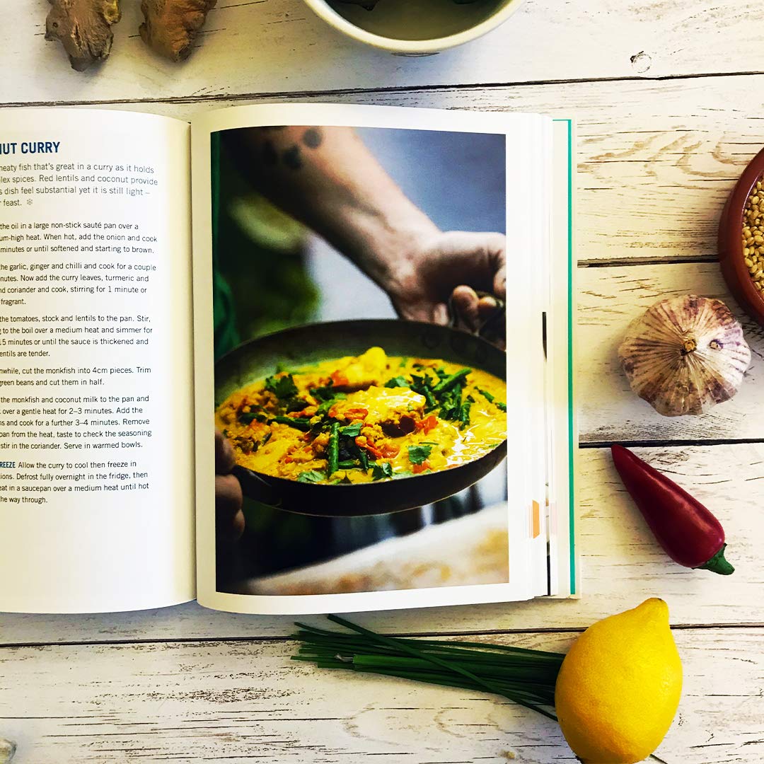 Hardback book "Lose Weight & Get Fit" by Tom Kerridge, featuring healthy recipes for dieting and fitness on a table.