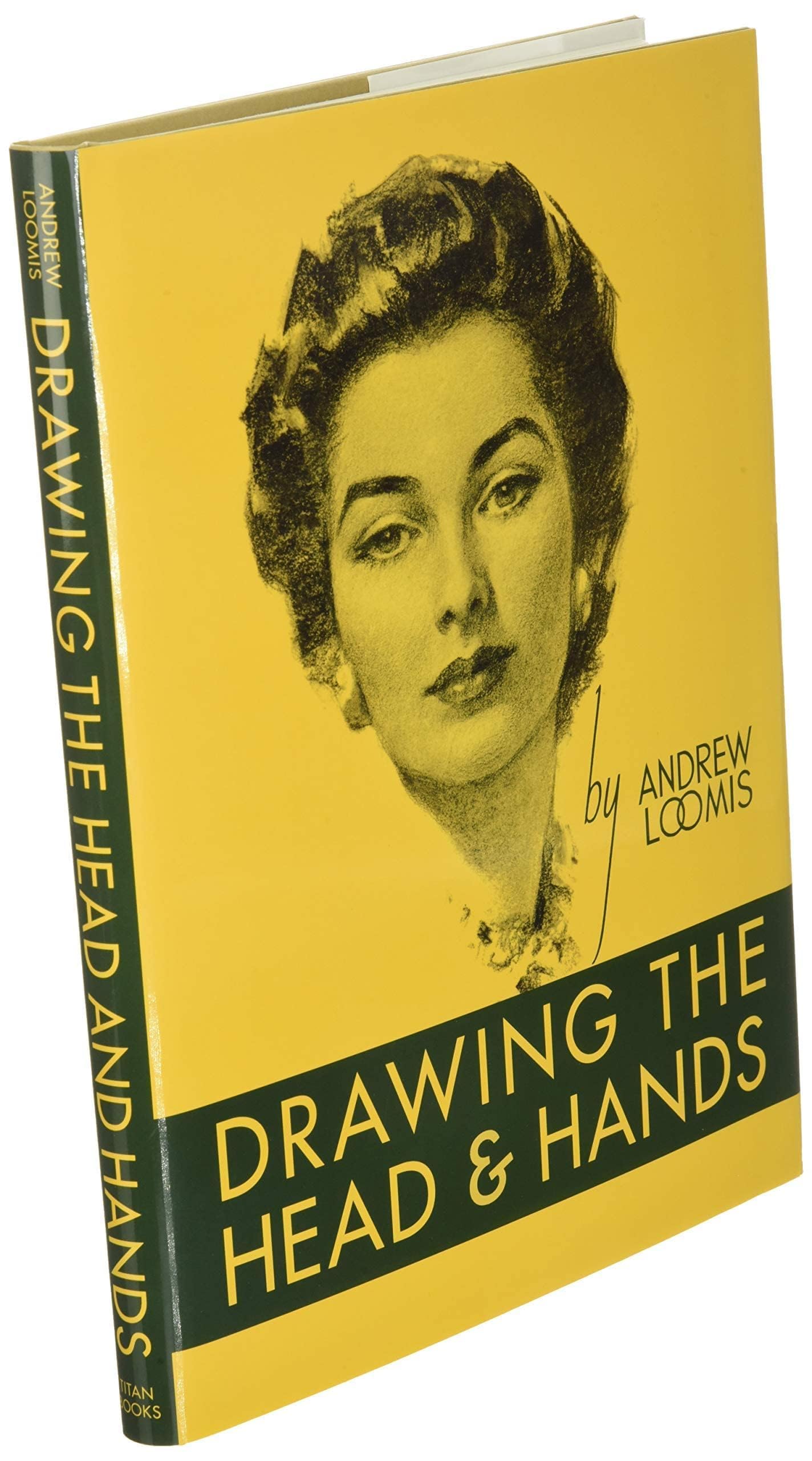 Hardback book "Drawing the Head and Hands" by Andrew Loomis, showcasing detailed illustrations and instructional content.