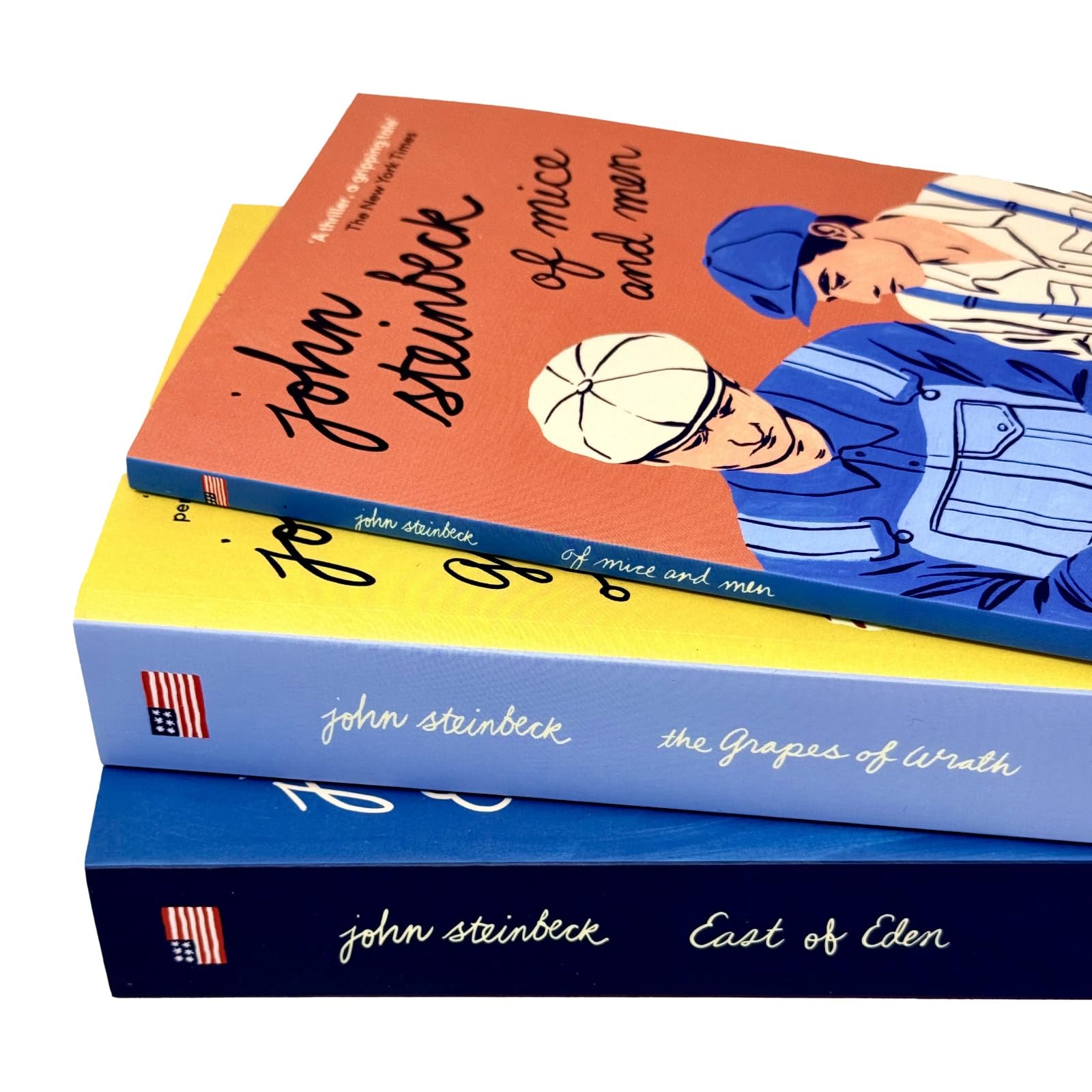 Three paperback John Steinbeck books from the Mr. John Steinbeck Collection by Penguin, featuring classic fiction titles.