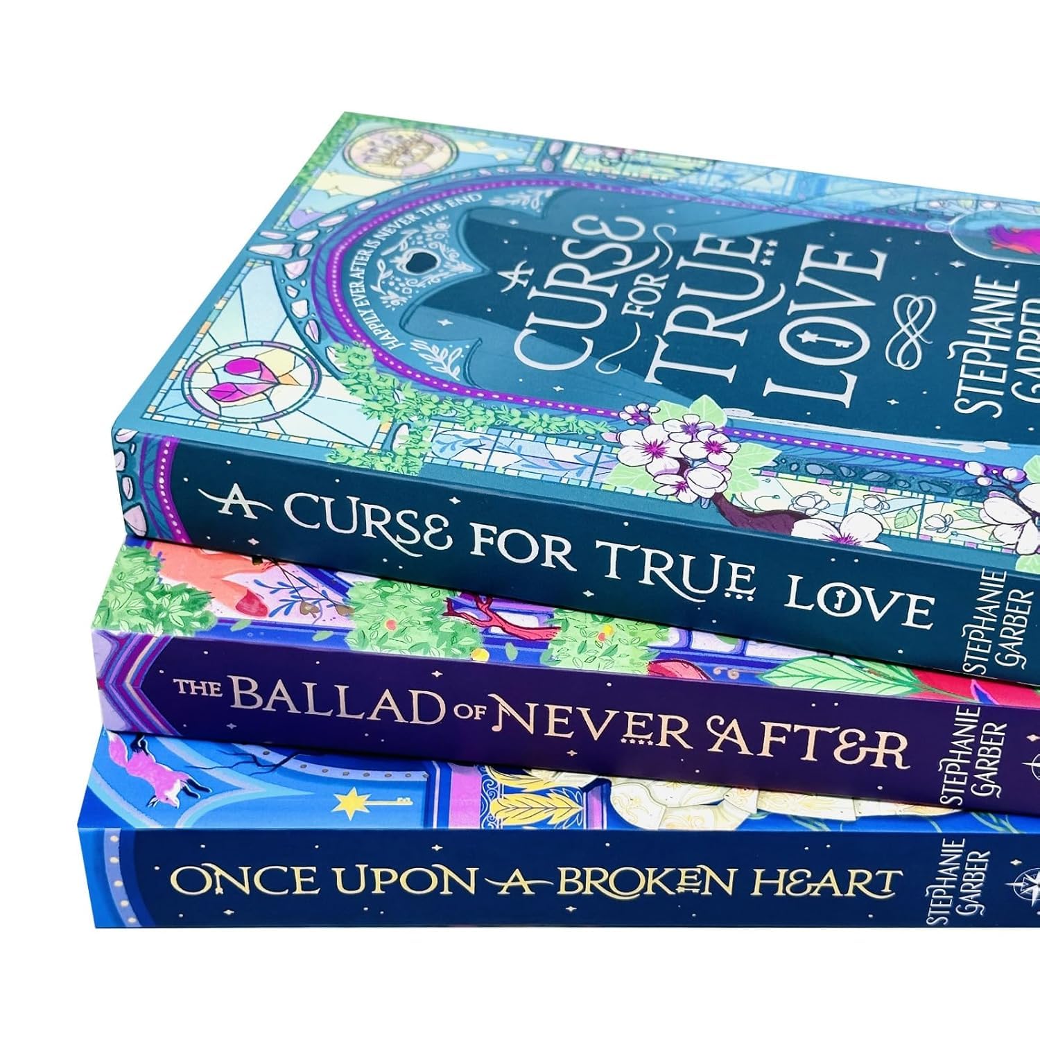 Three paperback books from Stephanie Garber's Once Upon a Broken Heart series, featuring colorful covers and fantasy artwork.