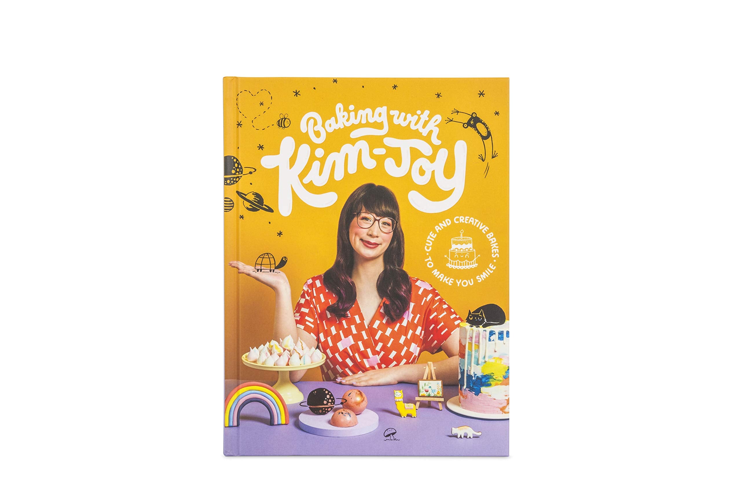 Hardback edition of "Baking With Kim-Joy" by Kim-Joy, showcasing colorful baking recipes and creative cake designs.