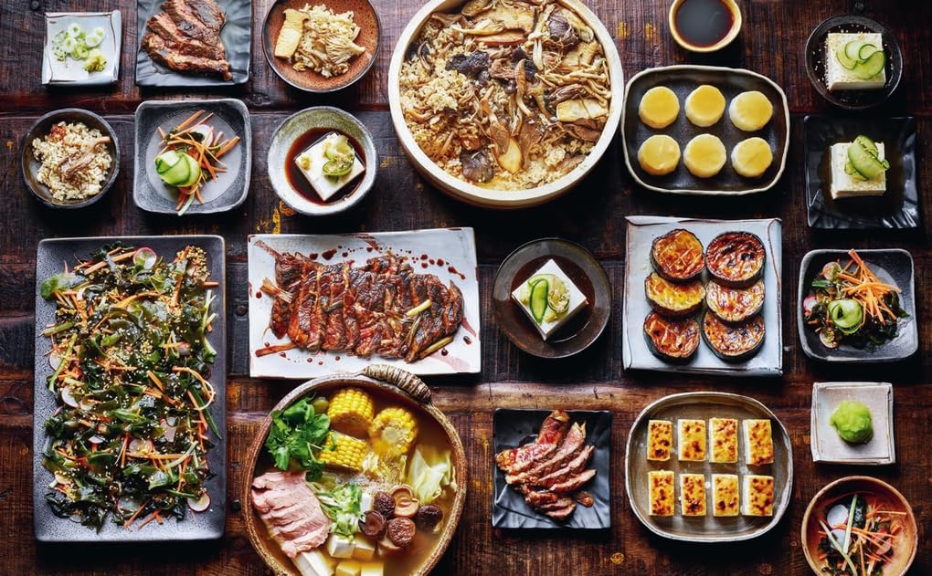 Hardback book "Simple Family Feasts" by Jeremy Pang, showcasing vibrant recipes and colorful food imagery.