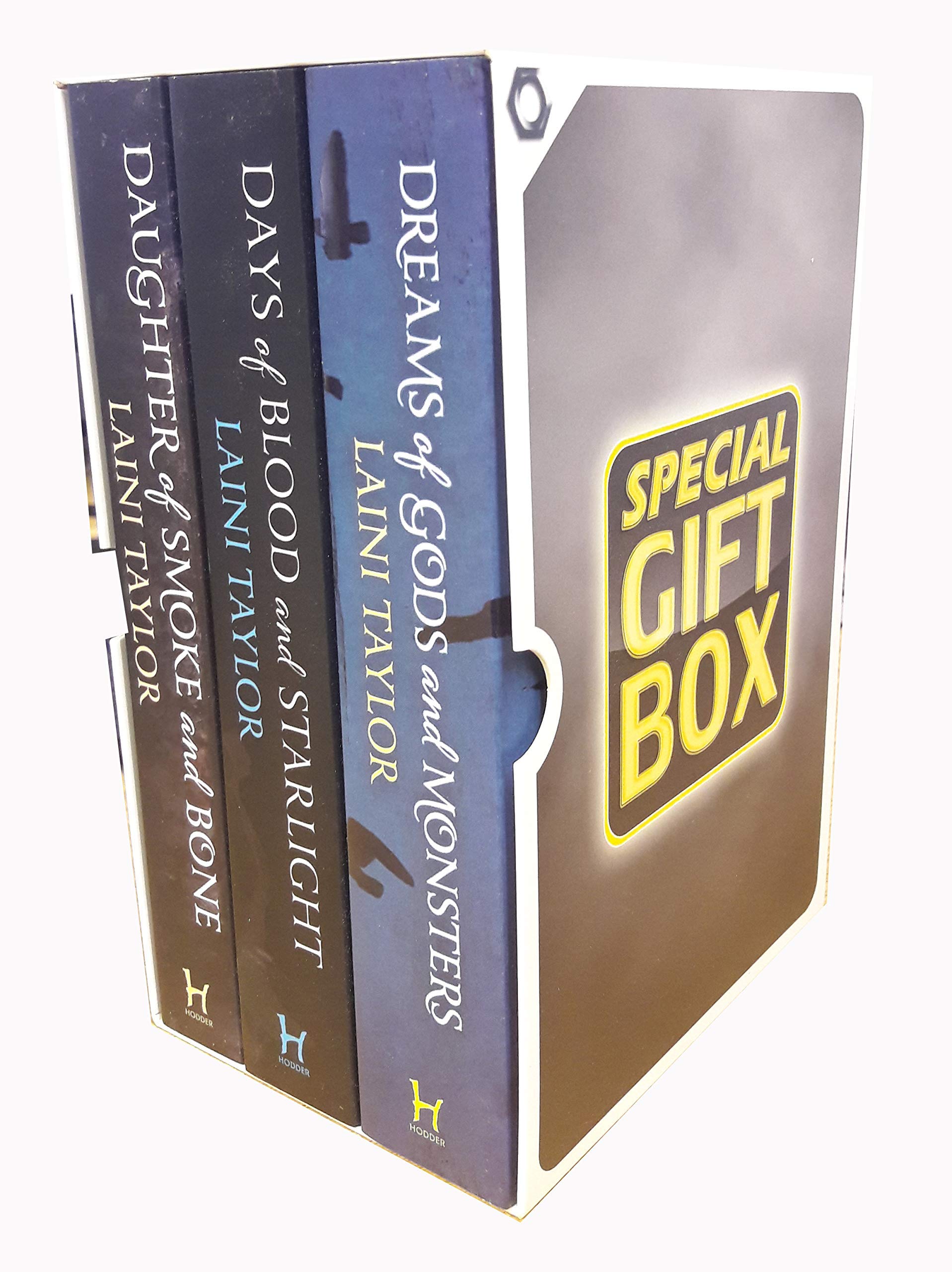 Daughter of Smoke and Bone by Laini Taylor, 3 paperback books collection box set on a wooden table.