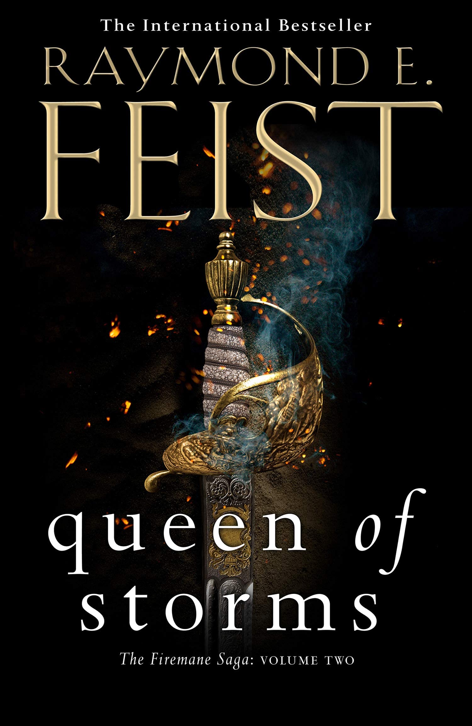 Three paperback books from "The Firemane Saga" by Raymond E. Feist, displayed with vibrant covers on a wooden surface.