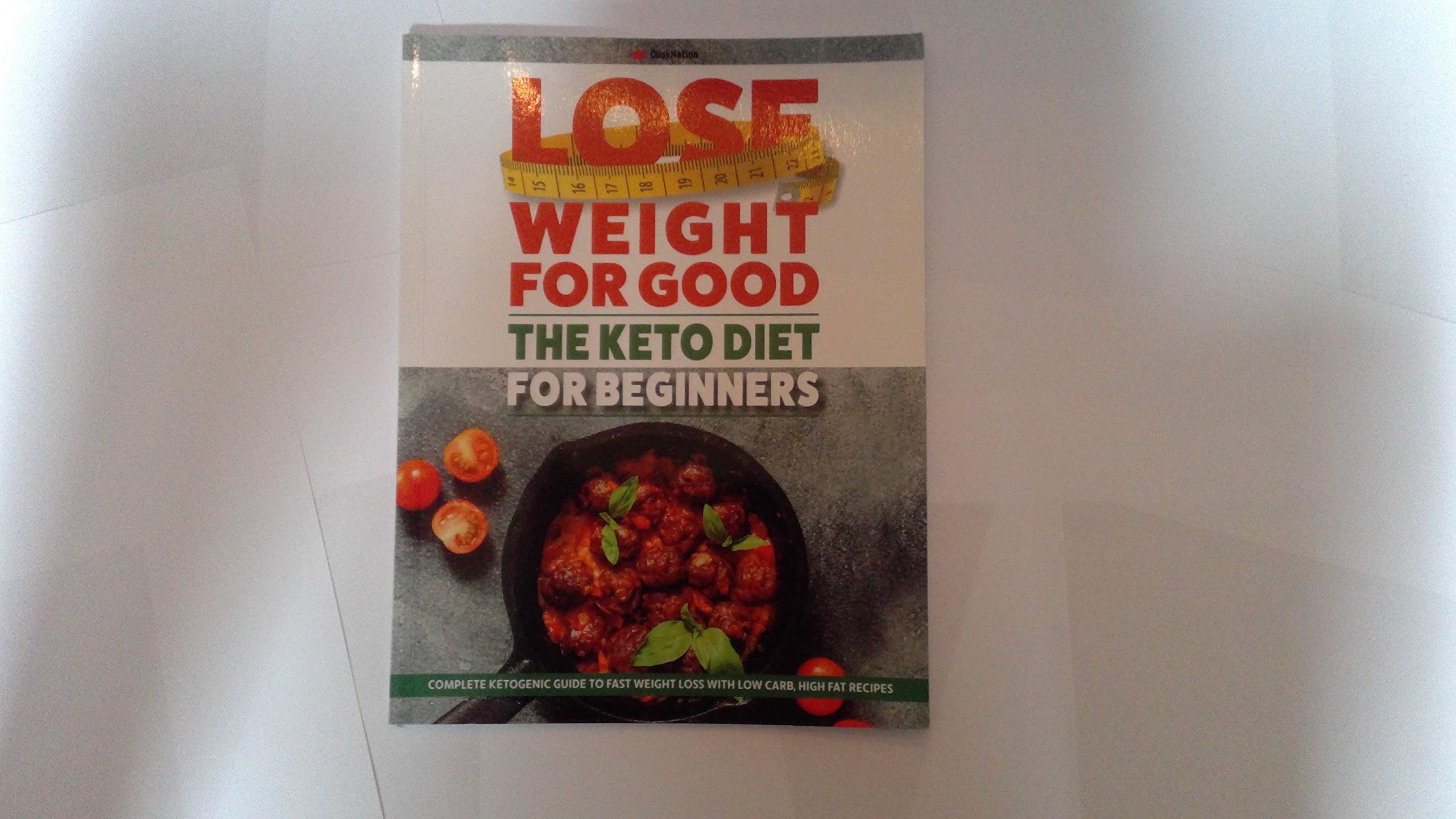 Paperback book "Lose Weight for Good: The Keto Diet for Beginners" by COONATION, featuring a colorful cover design.