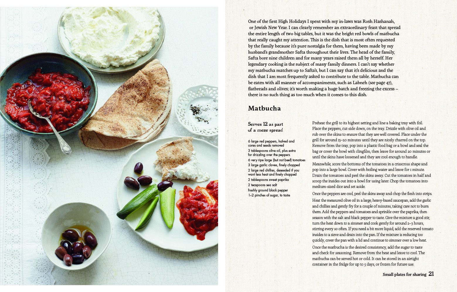Paperback copy of "Fress: Flavours From a Jewish Kitchen" by Emma Spitzer, showcasing vibrant food photography.