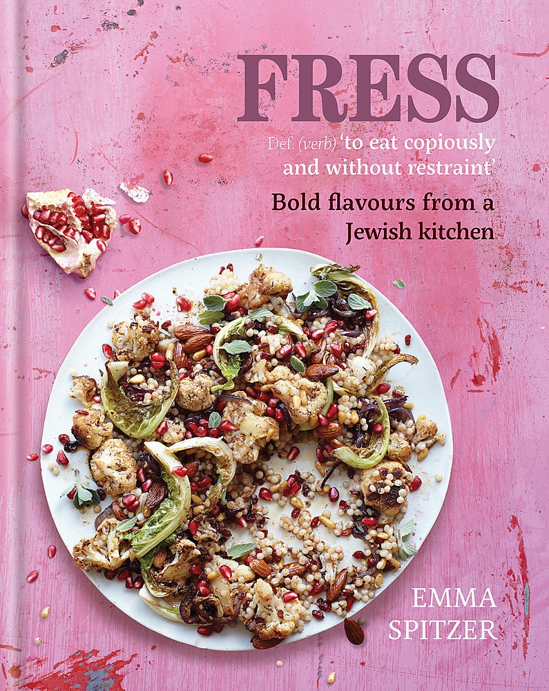 Paperback book "Fress: Flavours From a Jewish Kitchen" by Emma Spitzer displayed on a textured surface.