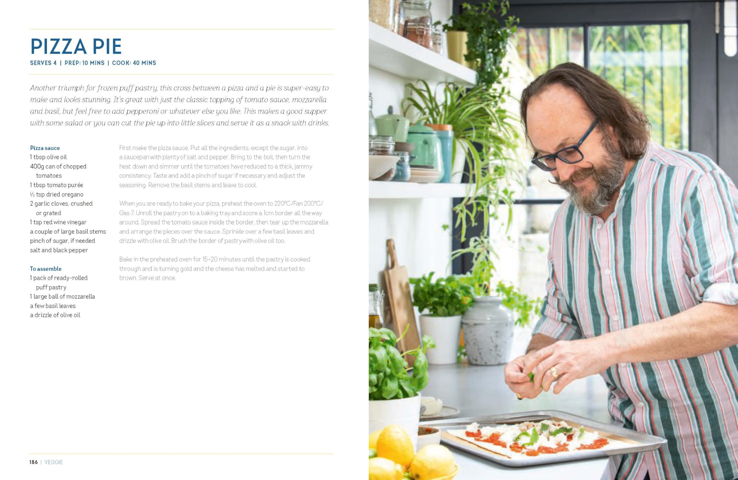 Hardback book "Hairy Bikers' Everyday Winners" featuring recipes by Hairy Bikers on a wooden kitchen table.