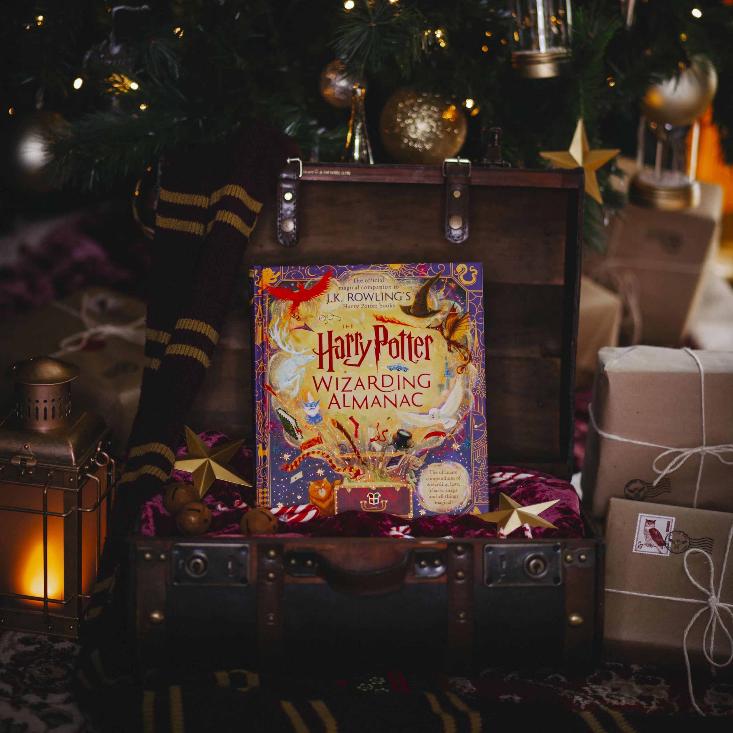 Hardback copy of The Harry Potter Wizarding Almanac by J.K. Rowling, featuring colorful illustrations and detailed content.