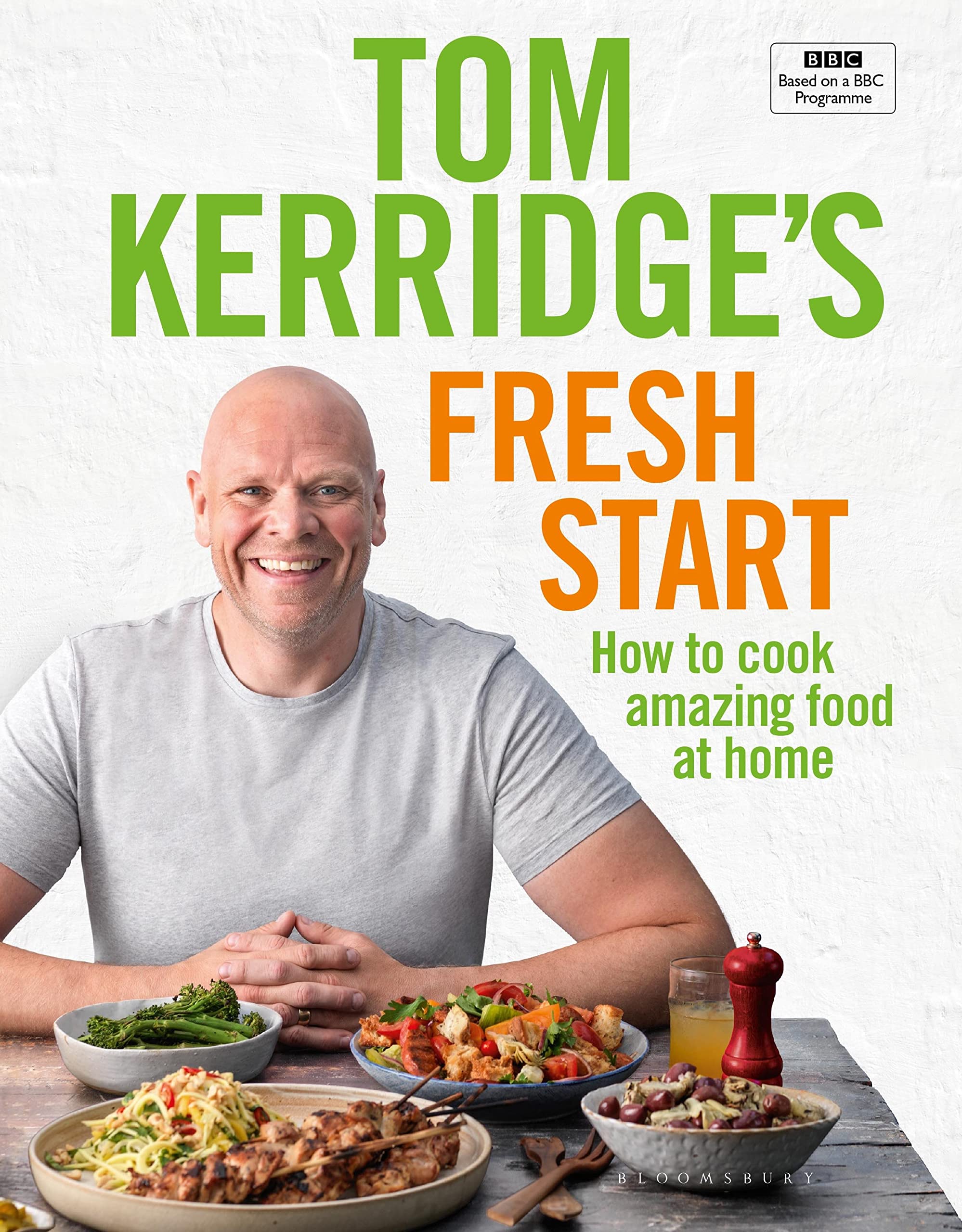 Hardback edition of "Fresh Start" by Tom Kerridge, showcasing the book cover and vibrant colors on a wooden table.