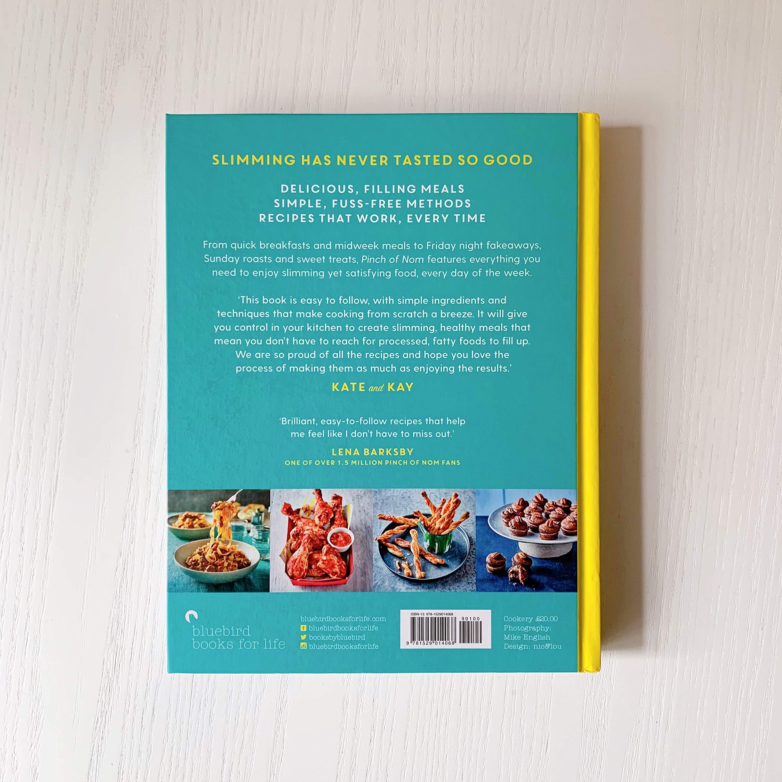 Hardback copy of "Pinch of Nom" by Kay Featherstone and Kate Allinson, showcasing the book cover design.