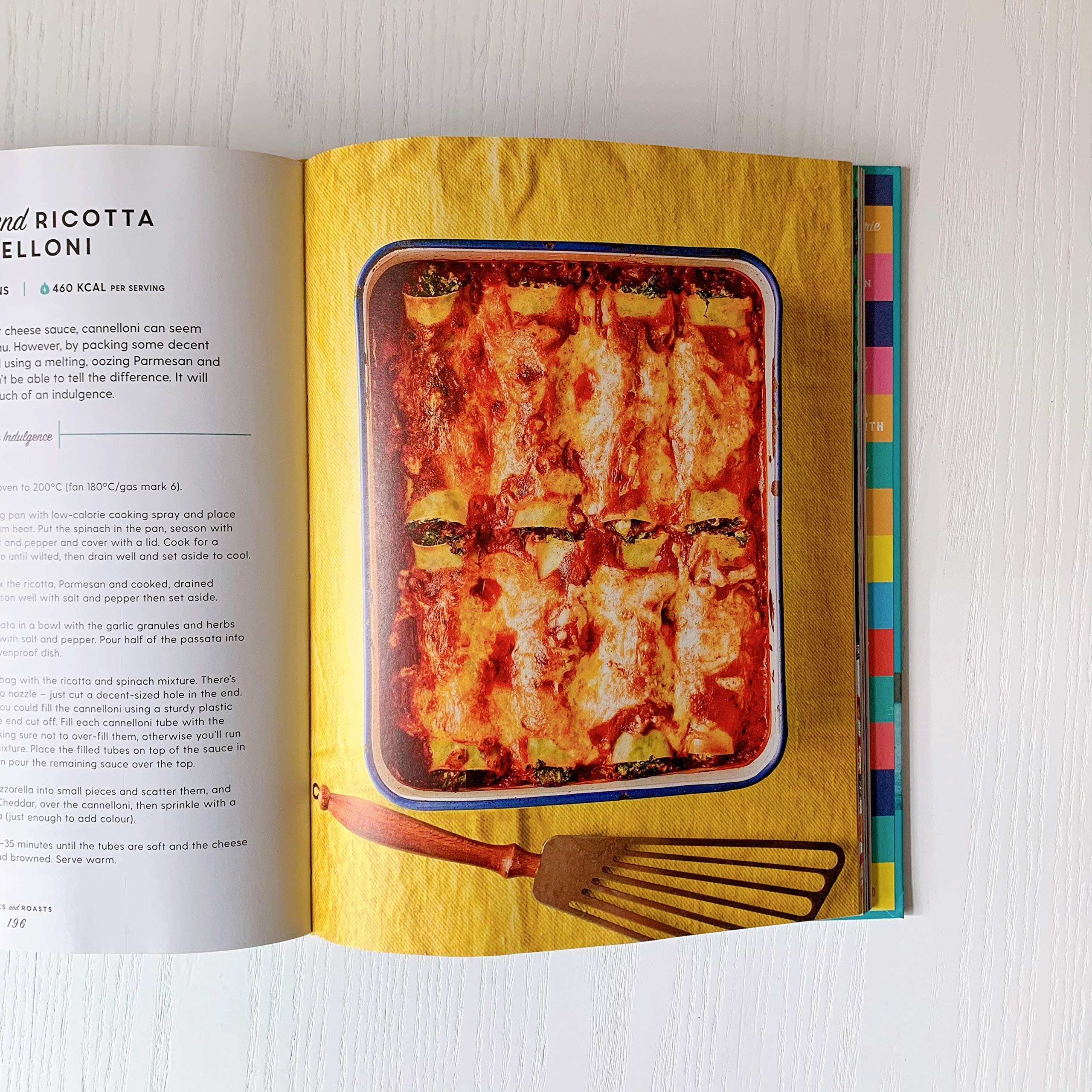 Hardback edition of "Pinch of Nom" by Kay Featherstone and Kate Allinson, featuring a colorful book cover.