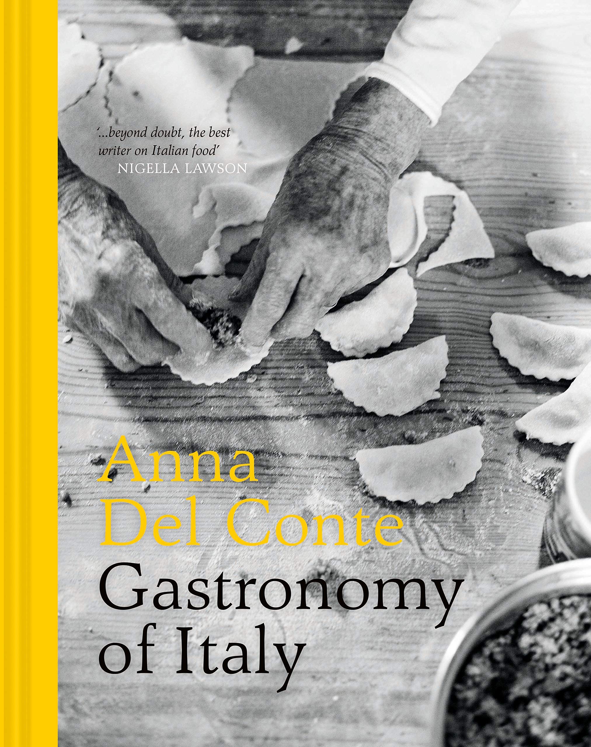 Anna Del Conte hardback book collection set featuring two non-fiction titles on a wooden surface with a cozy background.