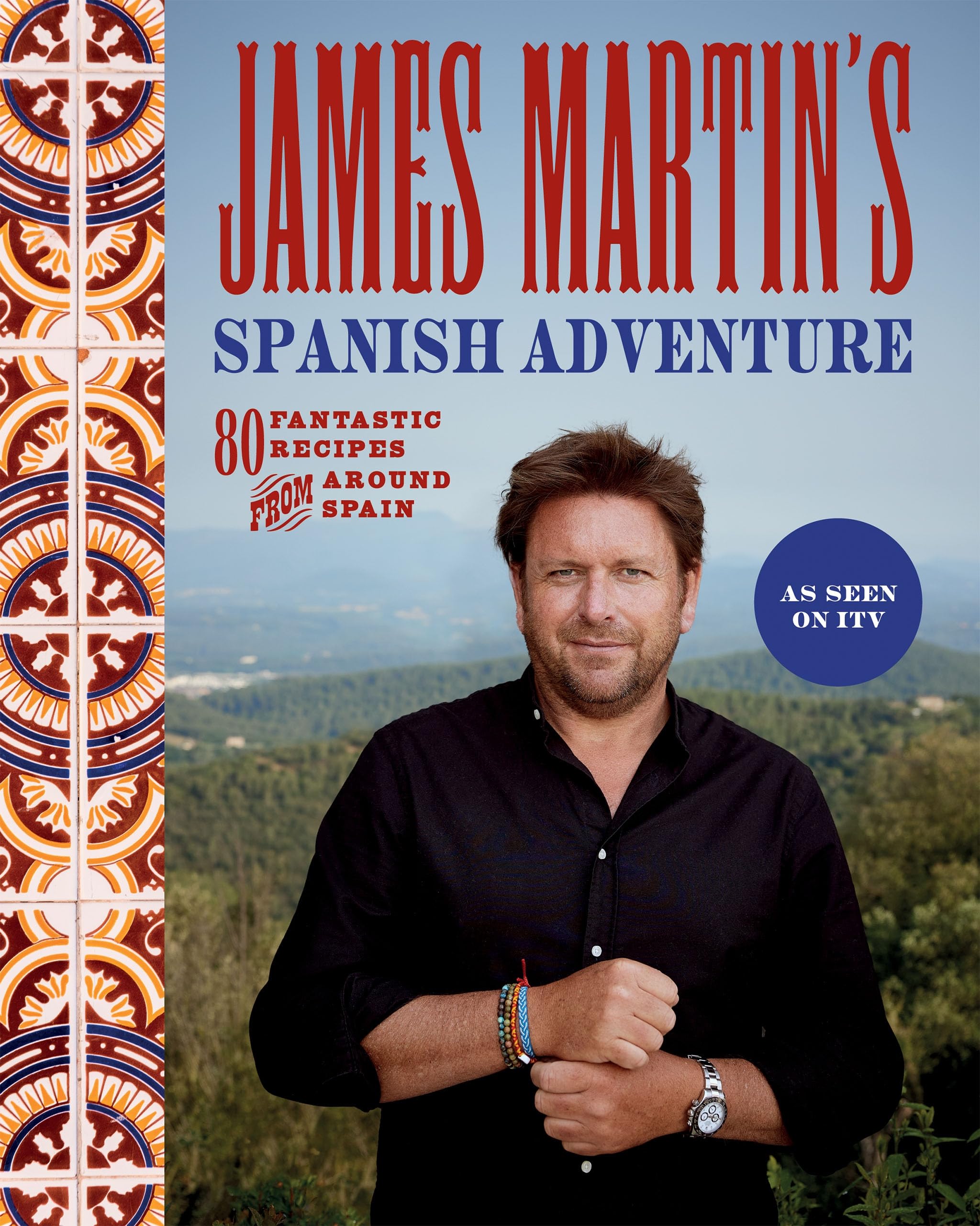 Hardback book "James Martin's Spanish Adventure" by James Martin, featuring a colorful cover and vivid imagery of Spanish cuisine.