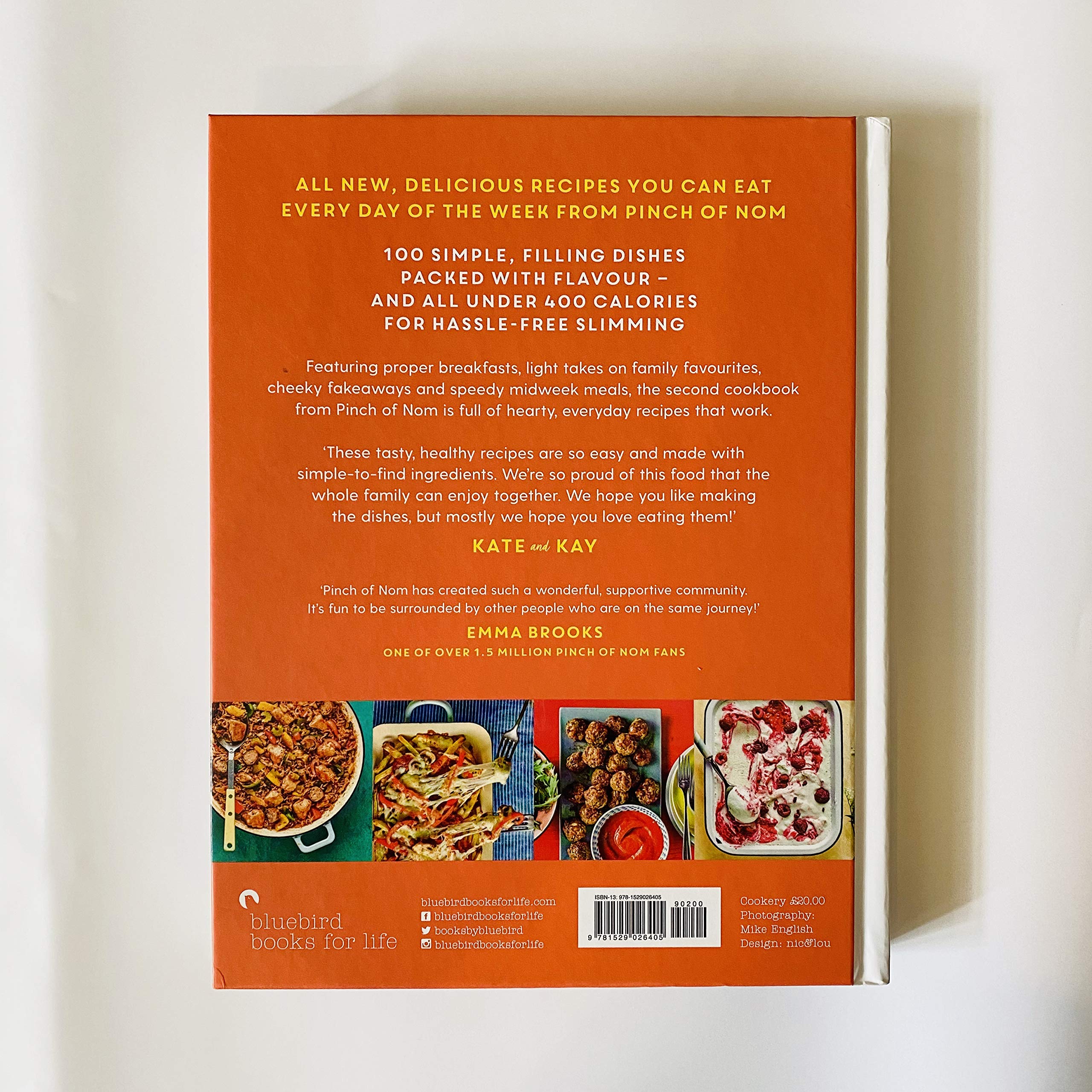 Hardcover book "Pinch Of Nom Everyday Light" by Kay and Kate Allinson featuring light recipes and colorful food photography.