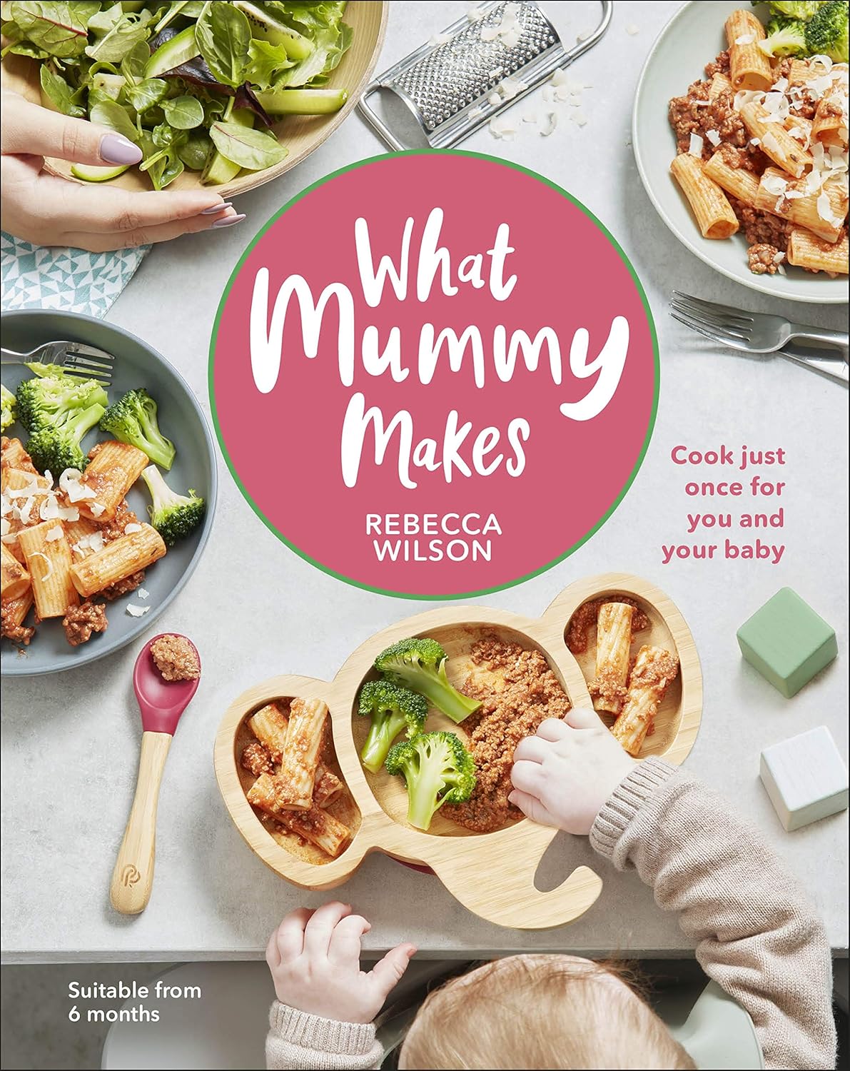 Hardcover of "What Mummy Makes" cookbook by Rebecca Wilson, featuring baby-friendly recipes and cooking tips on the cover.