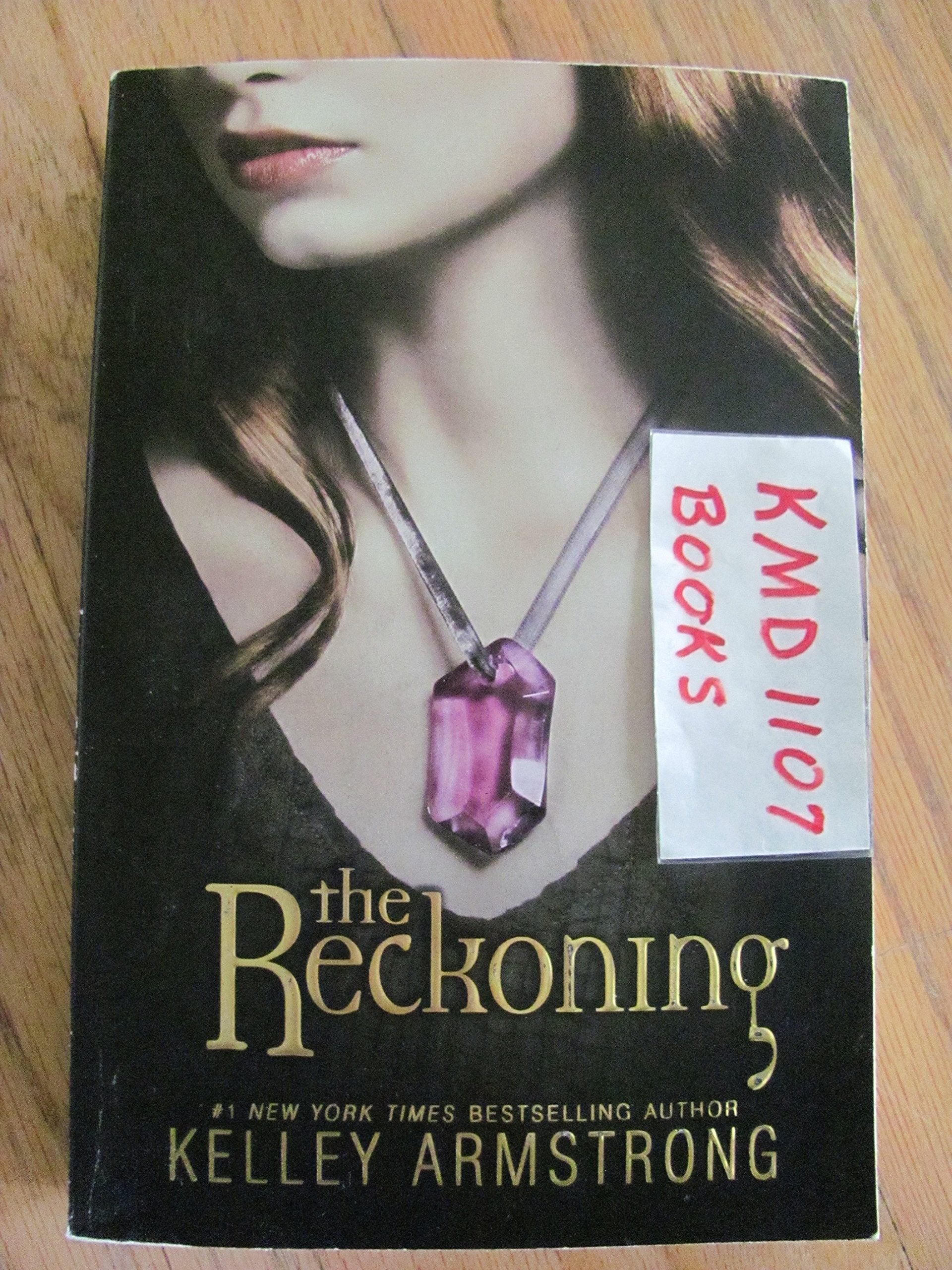 Reckoning Saga paperback book collection by various authors, featuring three gripping fiction novels on a table.