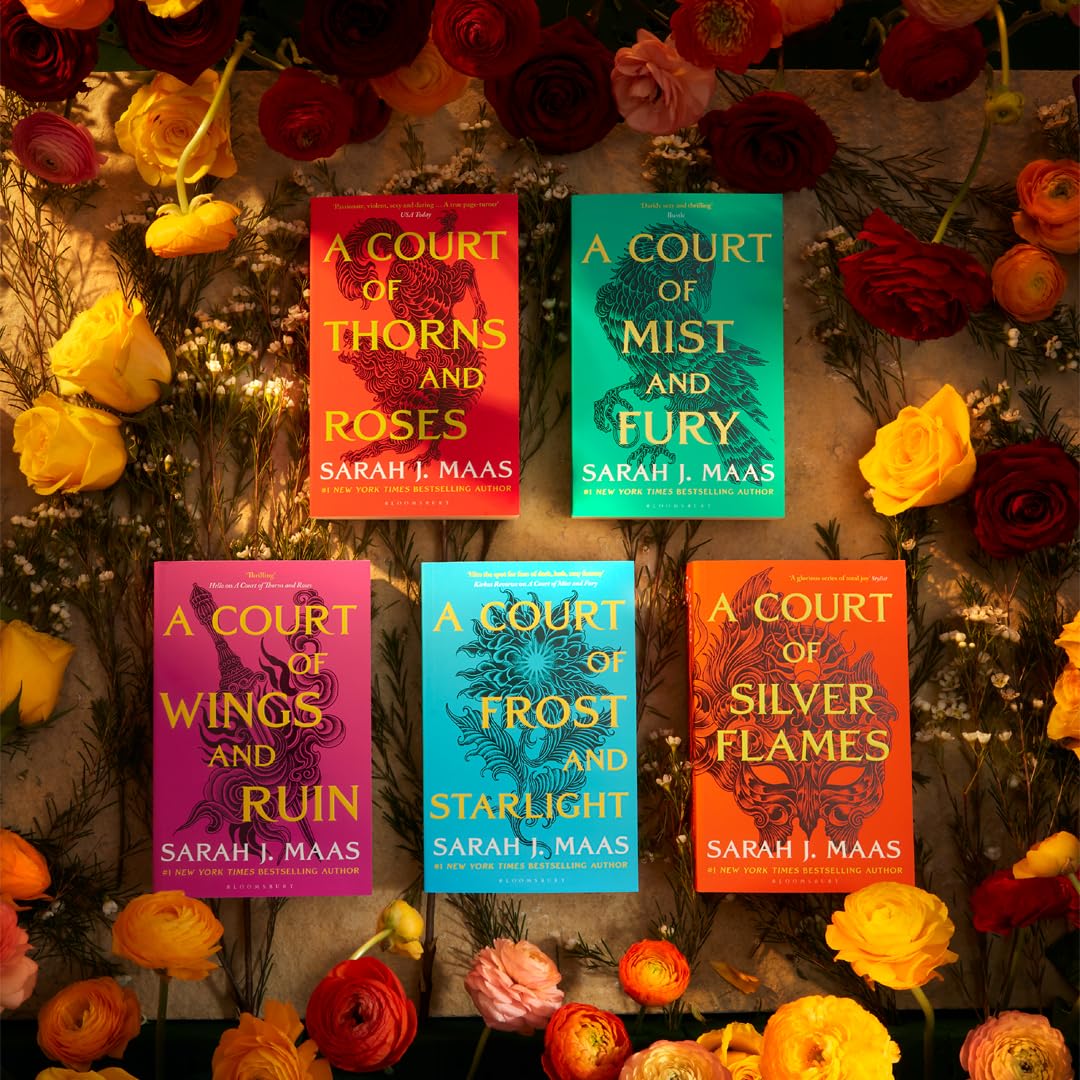 All five A Court of Thorns and Roses paperback covers fanned out showing the full Prythian series