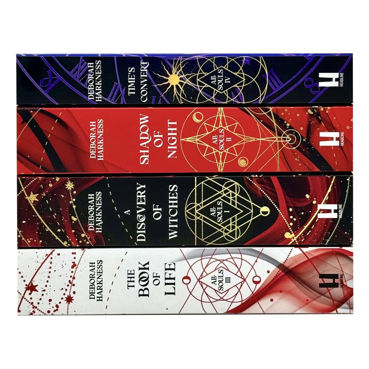 All Souls Series 4-book paperback set by Deborah Harkness displayed on a wooden surface.