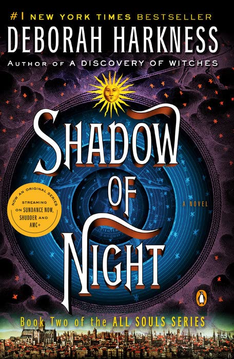 Close-up of A Discovery of Witches and Shadow of Night paperback covers from the All Souls Series