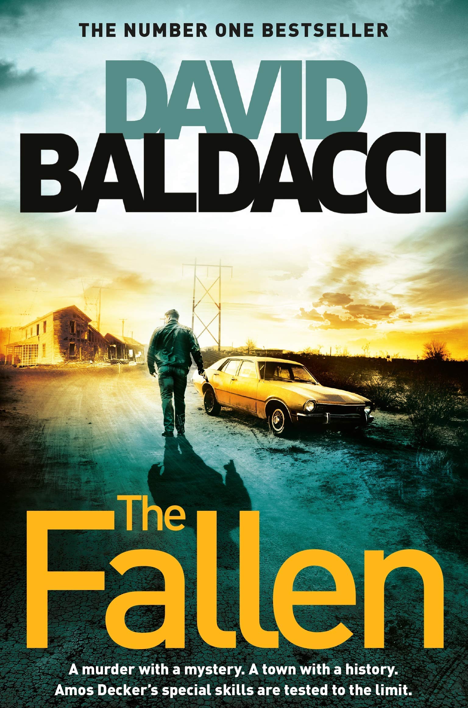 Close-up stack of Amos Decker paperback thrillers by David Baldacci, showing cover artwork detail.