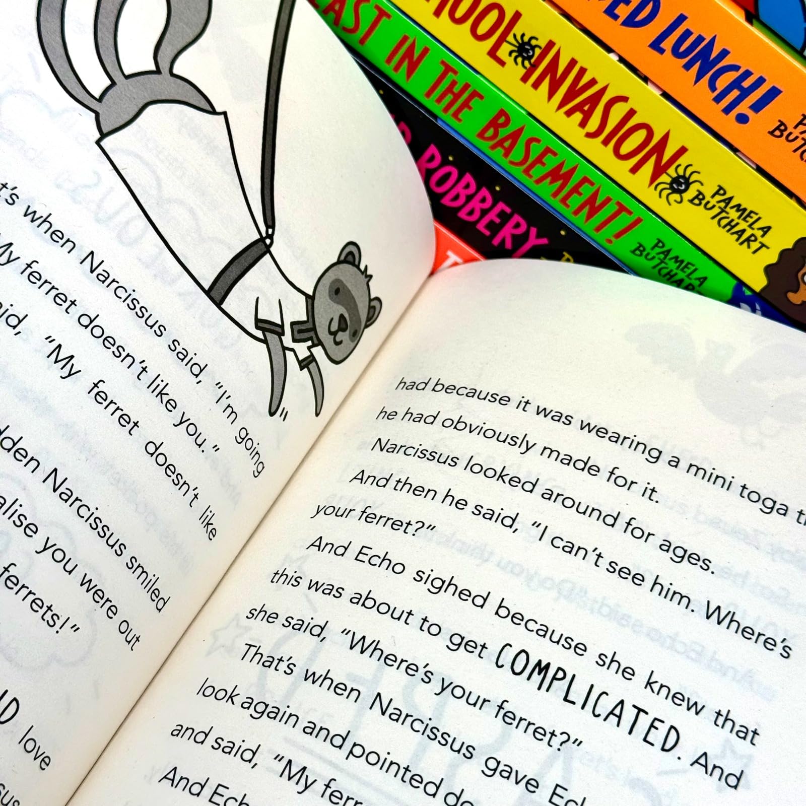 Close-up of Baby Aliens Izzy and Friends paperback book covers highlighting Thomas Flintham's illustrations