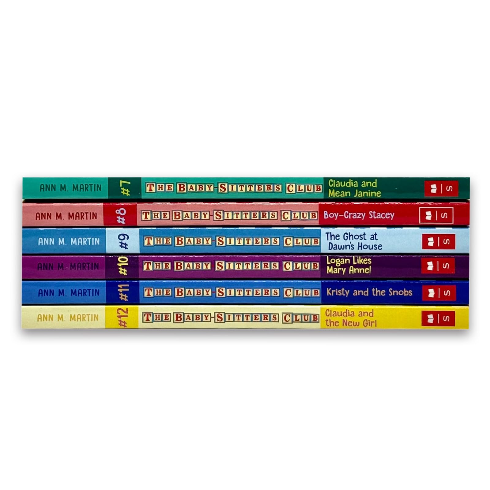 All six Baby-Sitters Club paperback books from Volumes 7-12 fanned out showing covers
