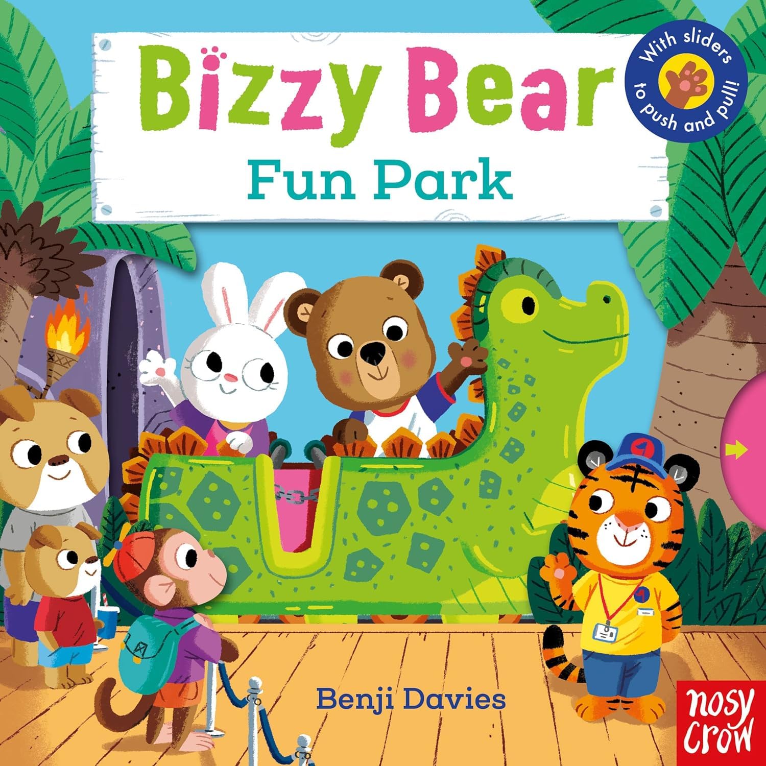 Close-up of Bizzy Bear: Dinosaur Safari board book cover featuring Bizzy Bear among prehistoric creatures