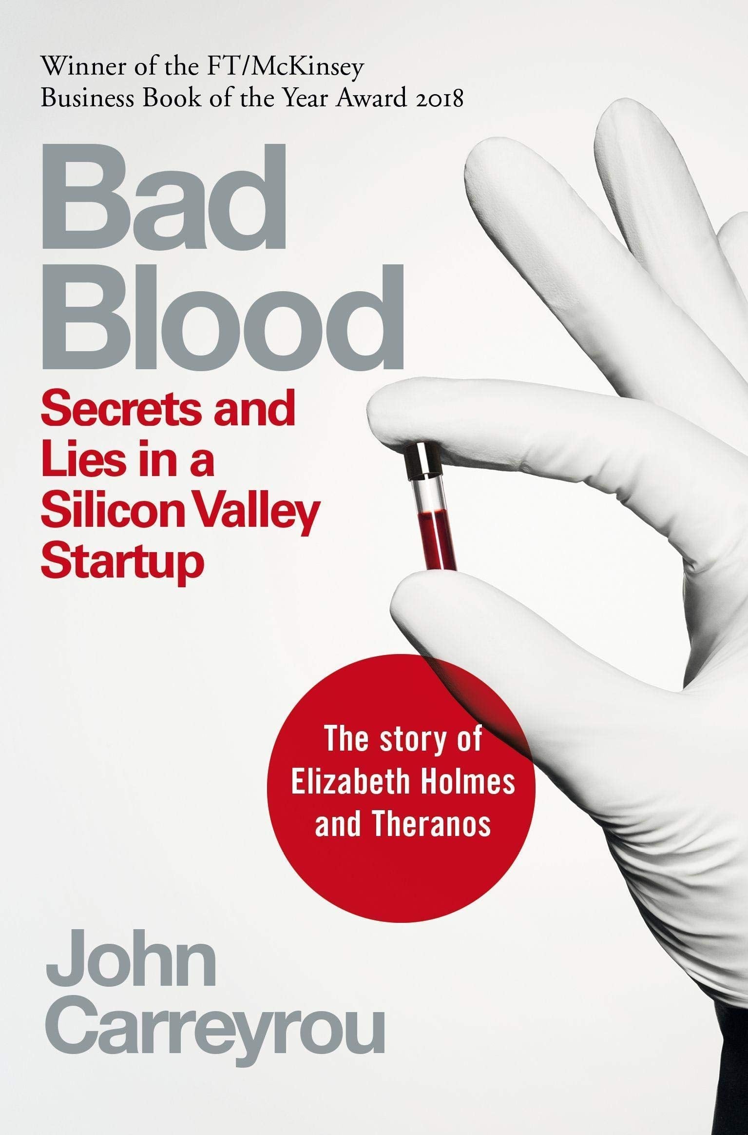 Close-up of Black Edge by Sheelah Kolhatkar and Bad Blood by John Carreyrou paperback covers
