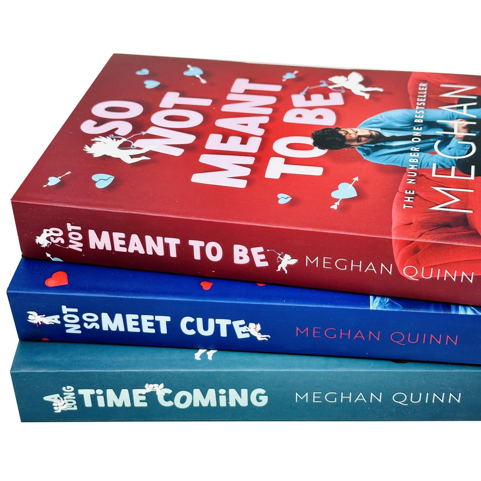 Close-up of Cane Brothers series paperback book spines by Meghan Quinn