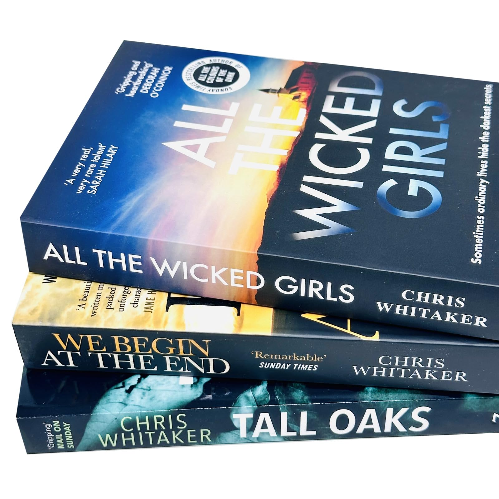 All three paperback books in the Chris Whitaker Collection fanned out to show spines and cover art