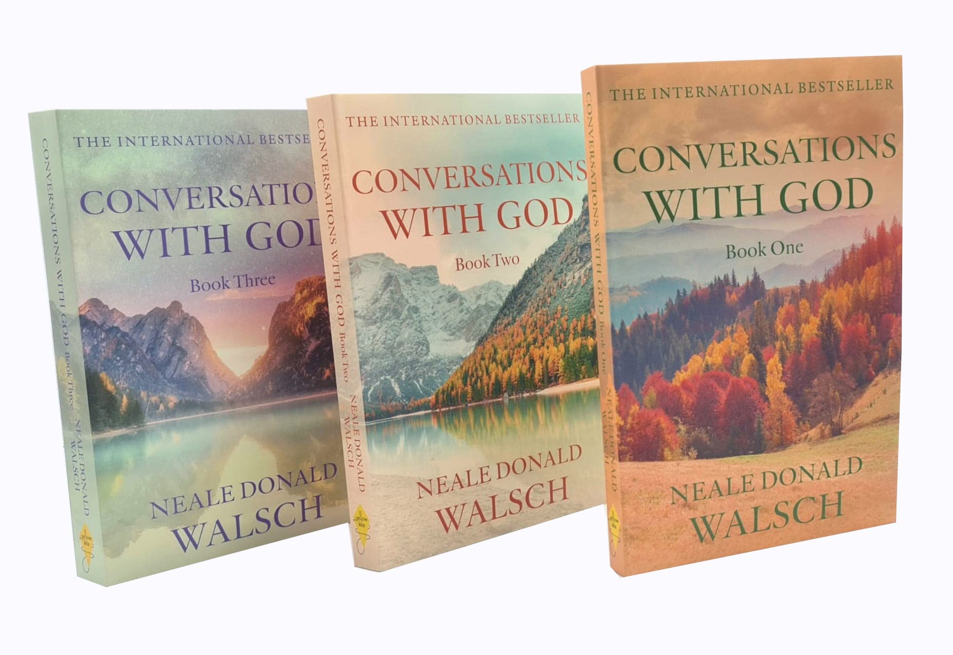 All three paperback books in the Conversations with God trilogy by Neale Donald Walsch fanned out to show spines and covers.